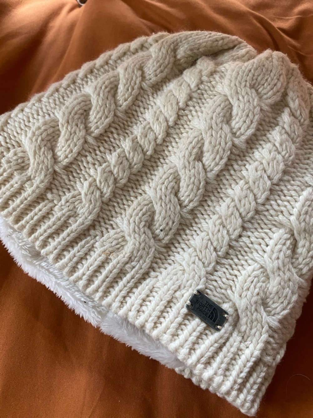 The North Face Cream Cable Knit Beanie with Fleece Lining